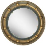A gilt frame circular convex mirror.