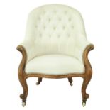 A Victorian walnut armchair.