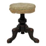 A Victorian walnut piano stool.