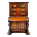 A late Victorian walnut apprentice type miniature cabinet.