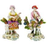 A pair of Continental porcelain gold anchor figures of Musicians.