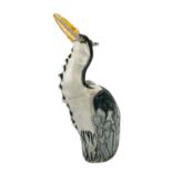 A Jennie Hale raku glazed figure of a heron.