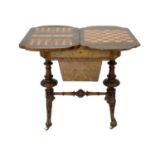 A Victorian burr walnut games and sewing quatrefoil table with boxwood inlay.