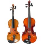 Two cased violins One 'after Stradivarius'.