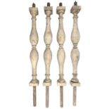 A set of four balusters