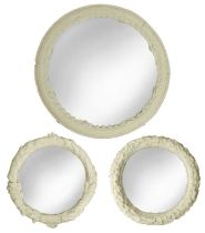 Three plaster-framed mirrors