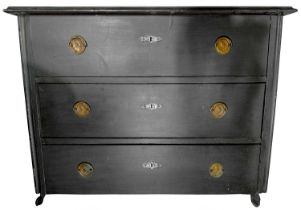 A Continental 19th century pine three drawer commode