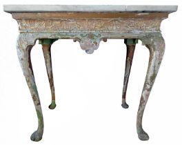 A George II gilt side table, in the manner of James Moore.