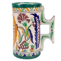 An Iznik style tin glazed pottery tankard, early 20th century.