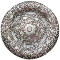 A Persian copper and inlaid silver dish, 19th century.