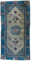 A Chinese rug, early 20th century.