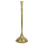 A large Persian engraved brass candlestick, 18th century.