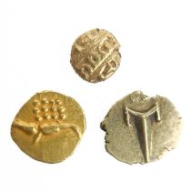 Three Indian gold Fanam coins.