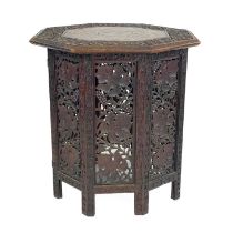 An Indian carved wood folding occasional table, 19th century.