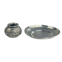 An Islamic silver dish engraved with Islamic script and a small ovoid pot.