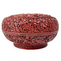 A Chinese cinnabar lacquer bowl and cover, late Qing dynasty.