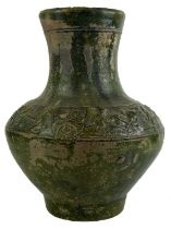 A Chinese green-glazed 'Hunting Scene' pottery vase, Han Dynasty. (206 BC-220 AD)