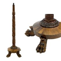 A 19th century carved mahogany and rosewood standard lamp.