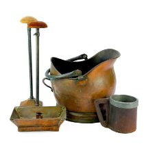 A pair of cast metal and tubular milliners adjustable hat stands.