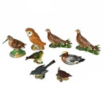 A collection of Beswick pottery birds.