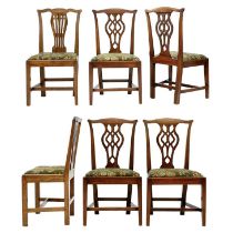 A set of three George III mahogany dining chairs.
