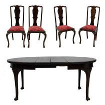 An Edwardian mahogany extending dining table stamped Maple & Co, and four chairs.