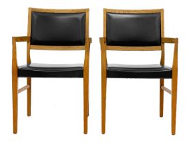 A pair of mid century Svegards Markaryd teak and vinyl armchairs