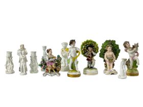 A Derby porcelain figure of a putti holding a basket of flowers.