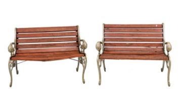 A pair of cast iron garden benches.