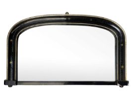 A Victorian ebonised and gilt arched overmantel mirror.