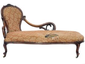 A mid 19th century walnut chaise longue.