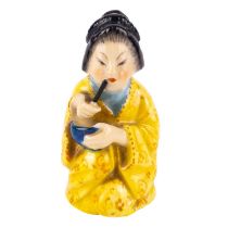 A Royal Worcester candle snuffer, modelled as a Geisha Girl.