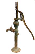 A cast iron village water pump.