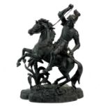 A spelter sculpture of a knight on horseback.