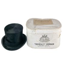 A Tress & Co silk top hat.