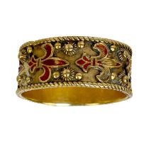 A 14ct gold and red champleve enamel band ring.