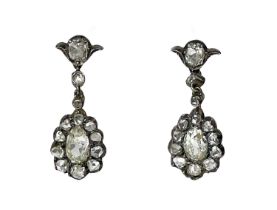 A pair of 19th century silver diamond set pendant earrings.