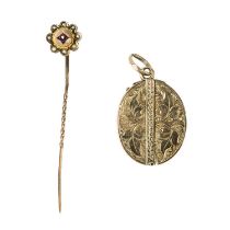 A Victorian embossed gold central hinged locket pendant.