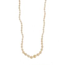 A graduated cultured pearl necklace with gold and white metal clasp set with three diamonds.