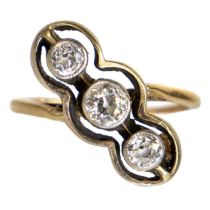 An early 20th century gold diamond set three-stone crossover ring.