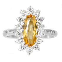 An 18ct white gold Imperial Topaz and diamond set cluster ring.