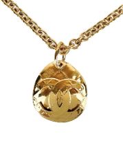 A Chanel 24ct gold-plated oval quilted CC pendant necklace, circa 1994.