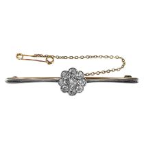 An early 20th century gold and platinum diamond cluster bar brooch.