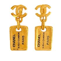 A Chanel 24ct gold-plated pair of CC and label pendant earrings, circa 1980's.