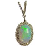 A white opal and diamond cluster white gold pendant.