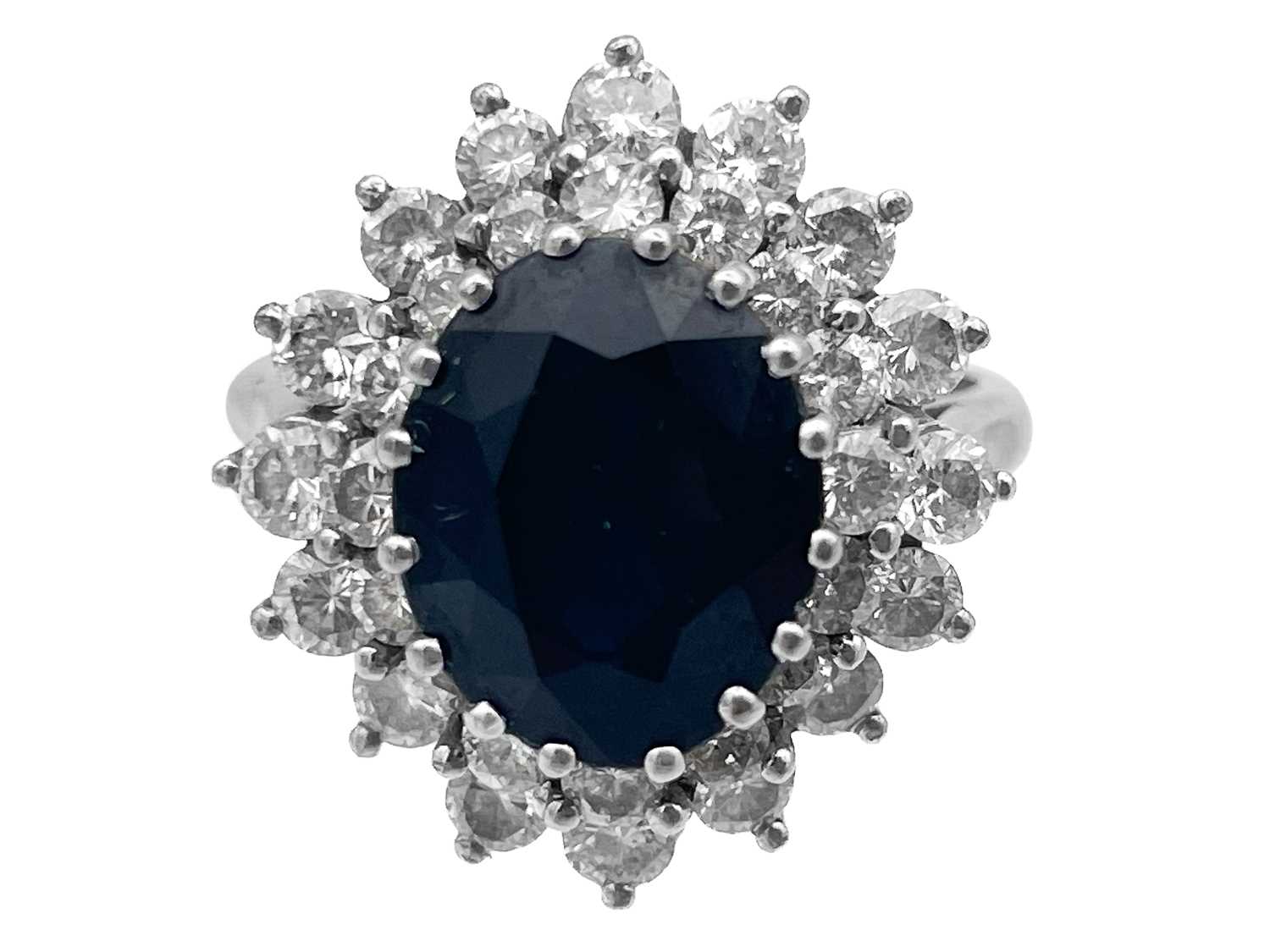 An 18ct white gold diamond and sapphire cluster ring with a pair of matching earrings. - Image 4 of 5
