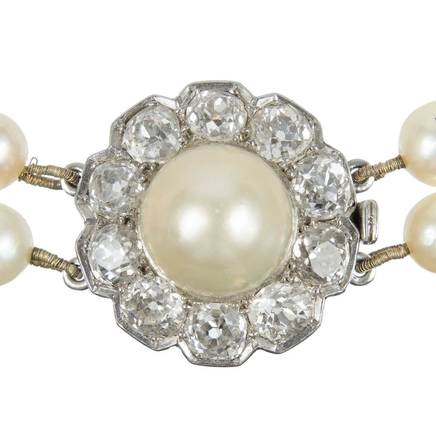 An impressive early 20th century cultured pearl, diamond set, double-row necklace & earrings suite. - Image 7 of 9