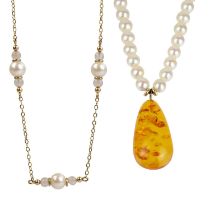 Two cultured pearl necklaces, one with an amber drop.