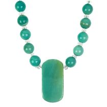 A rock crystal and chrysoprase necklace with facet cut oblong pendant.