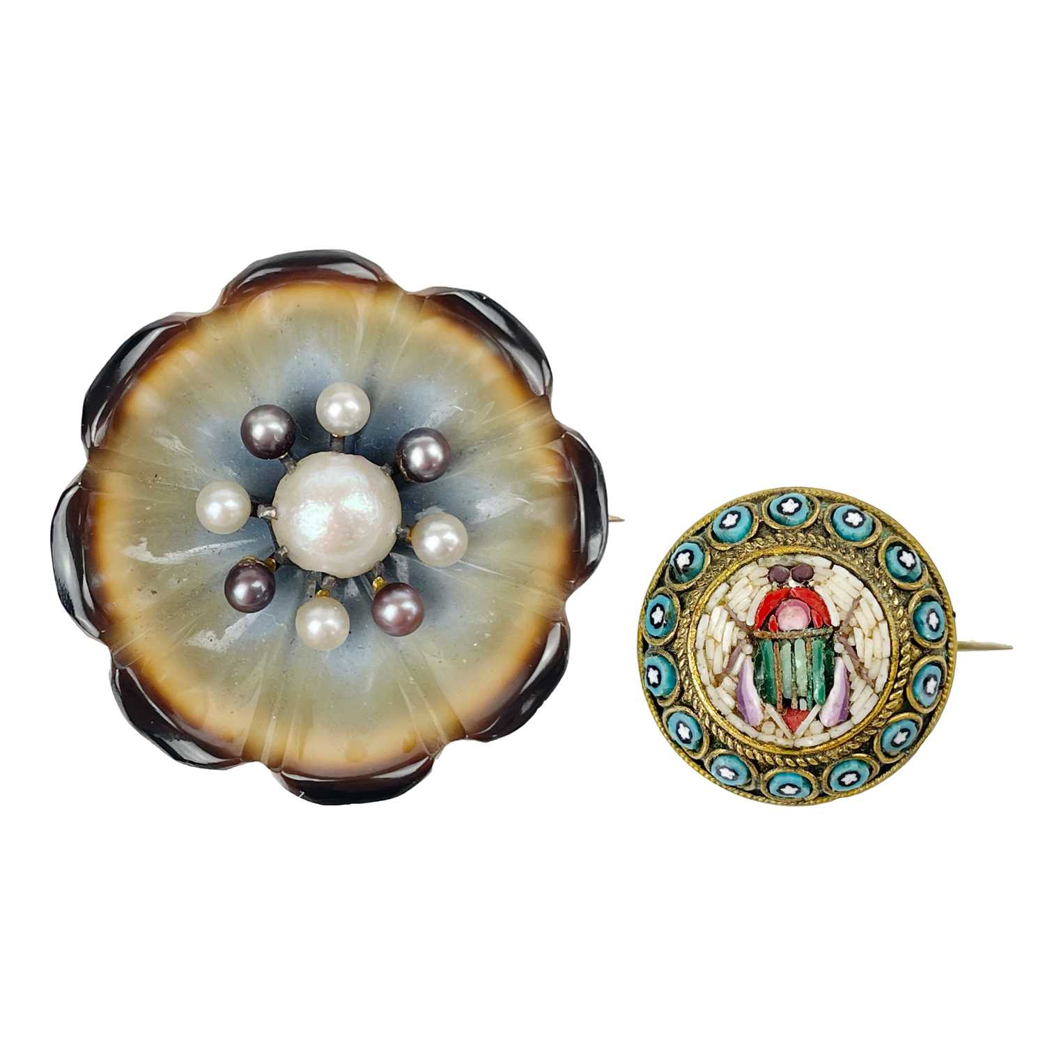 A Victorian micromosaic beetle decorated brooch and a carved banded agate and pearl flower brooch.